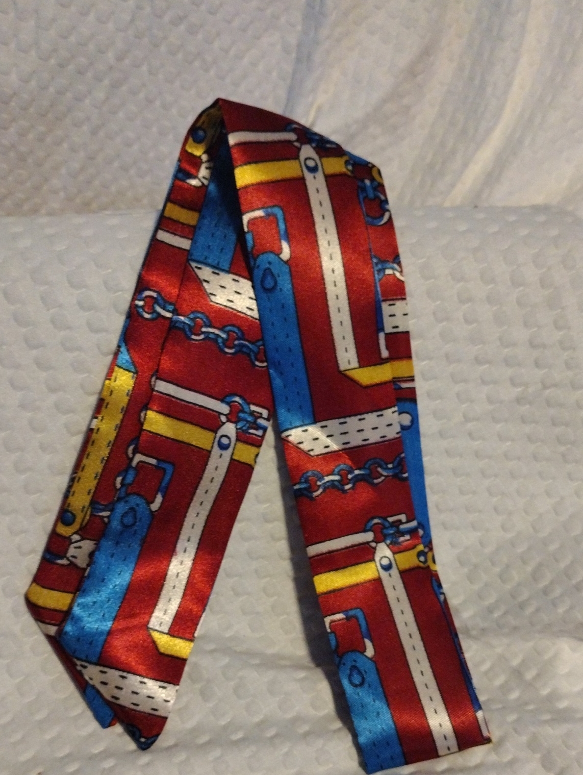 Red Patterned Silk Scarf With Blue And Yellow Accents